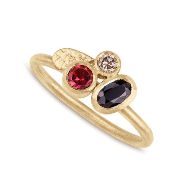 Deep blue Sapphire Happenstance Cluster ring by Alison Macleod displayed on a white backgrund