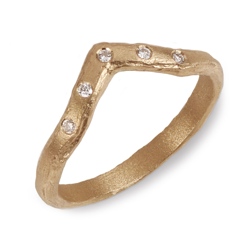 Textured Gold Wishbone Ring With five Diamonds on a white background 